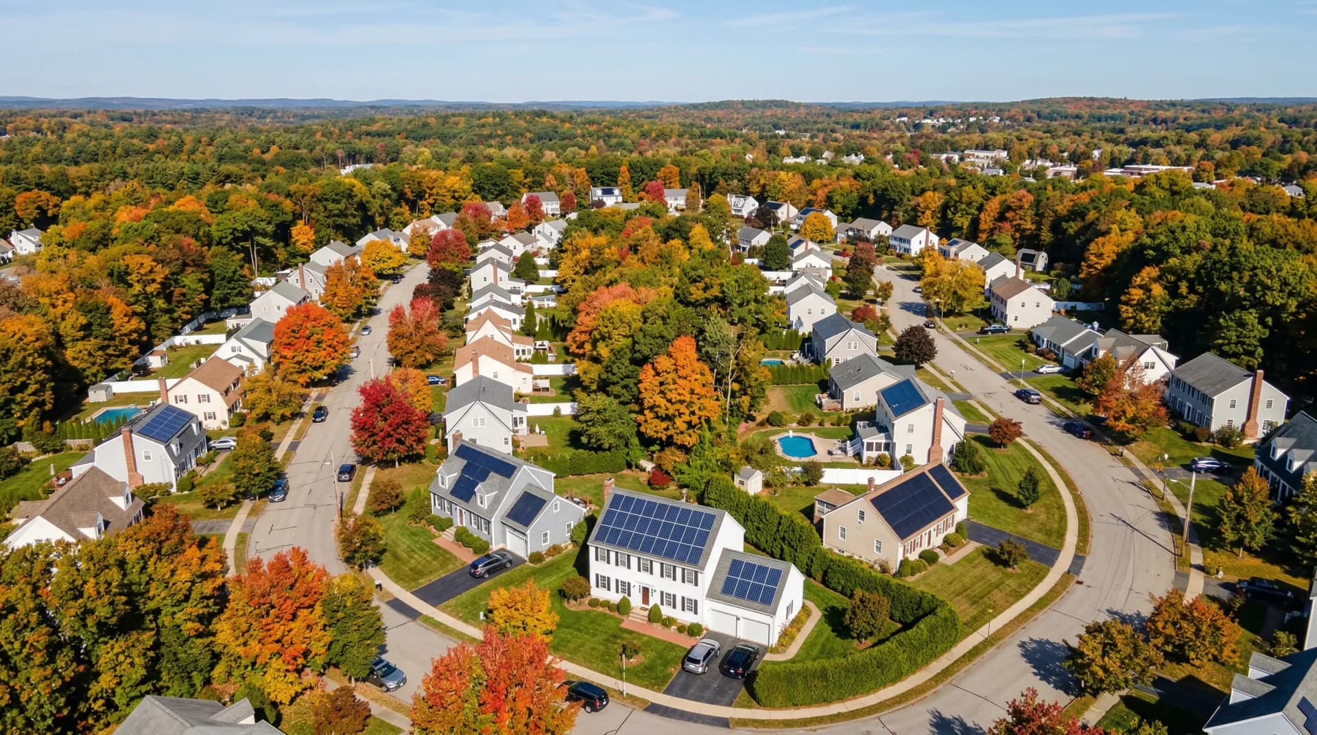 Solar panel installation comparison on Massachusetts homes showing different panel types and configurations