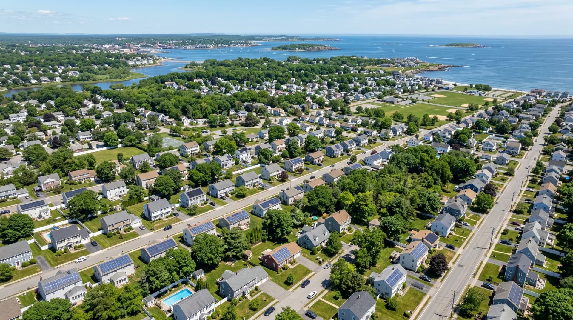 Aerial view of Beverly Massachusetts with solar panels on residential rooftops