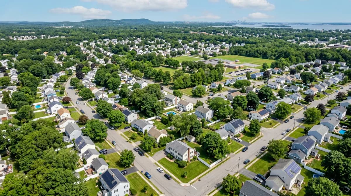Aerial view of Braintree Massachusetts with solar panels on residential rooftops