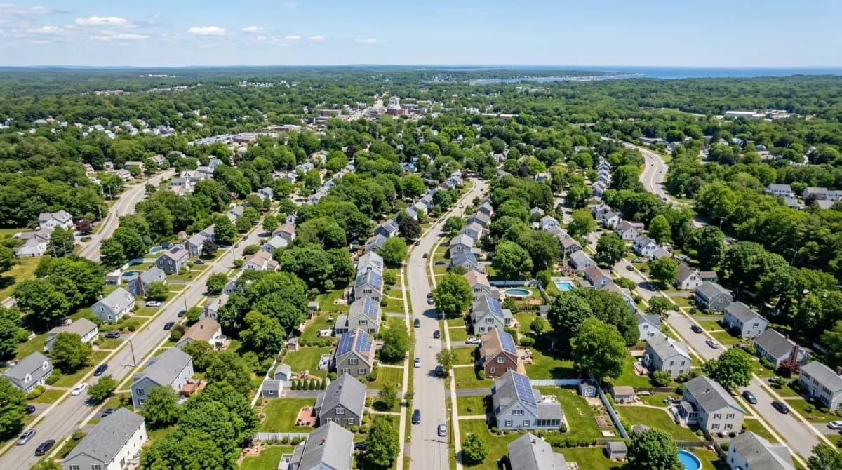 Aerial view of Danvers Massachusetts with solar panels on residential rooftops