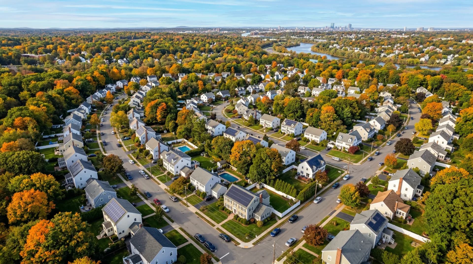 Aerial view of Dedham Massachusetts with solar panels on residential rooftops