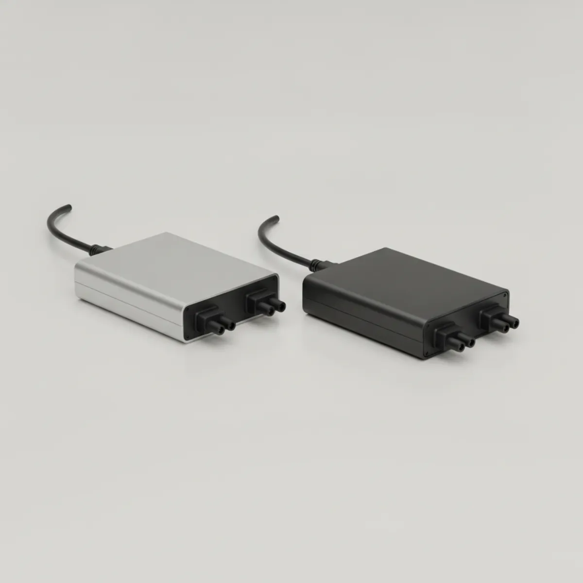 Enphase IQ9N gallium-nitride microinverter beside an IQ8 silicon unit on a technical surface