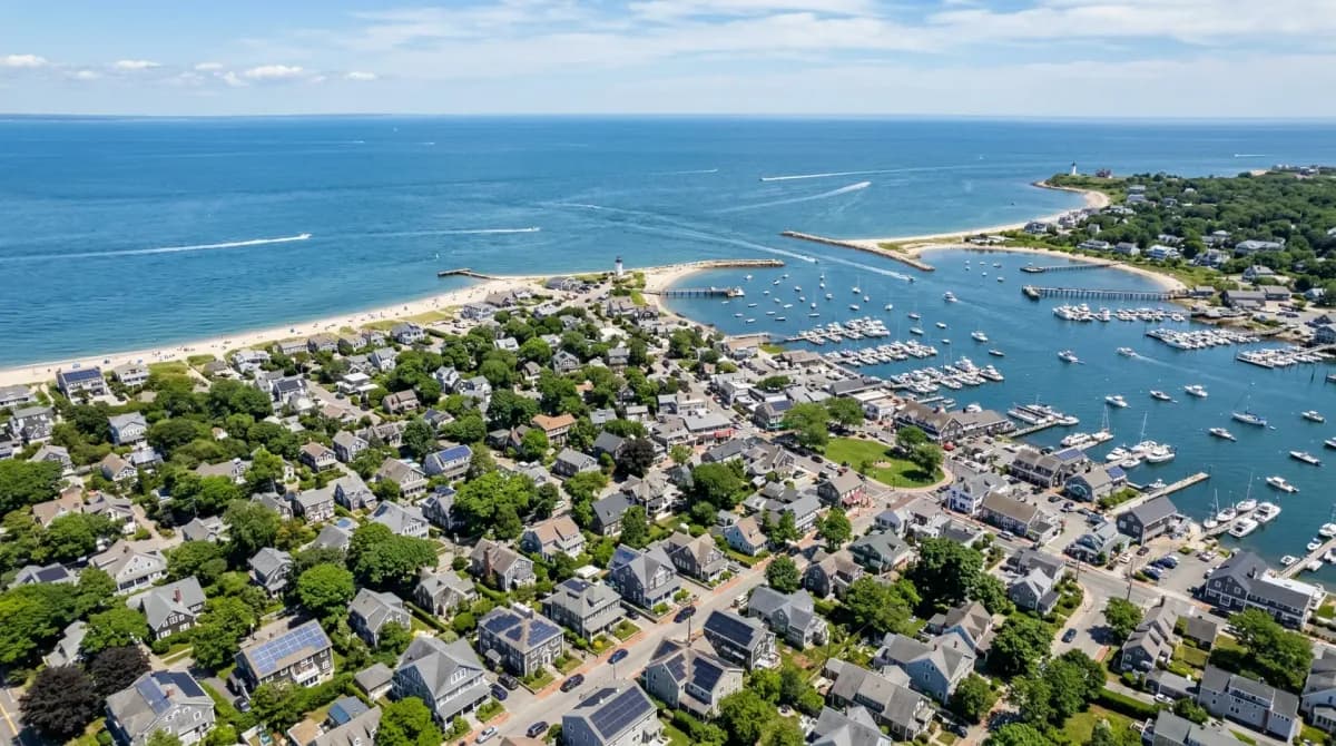 Aerial view of Falmouth Massachusetts with solar panels on residential rooftops