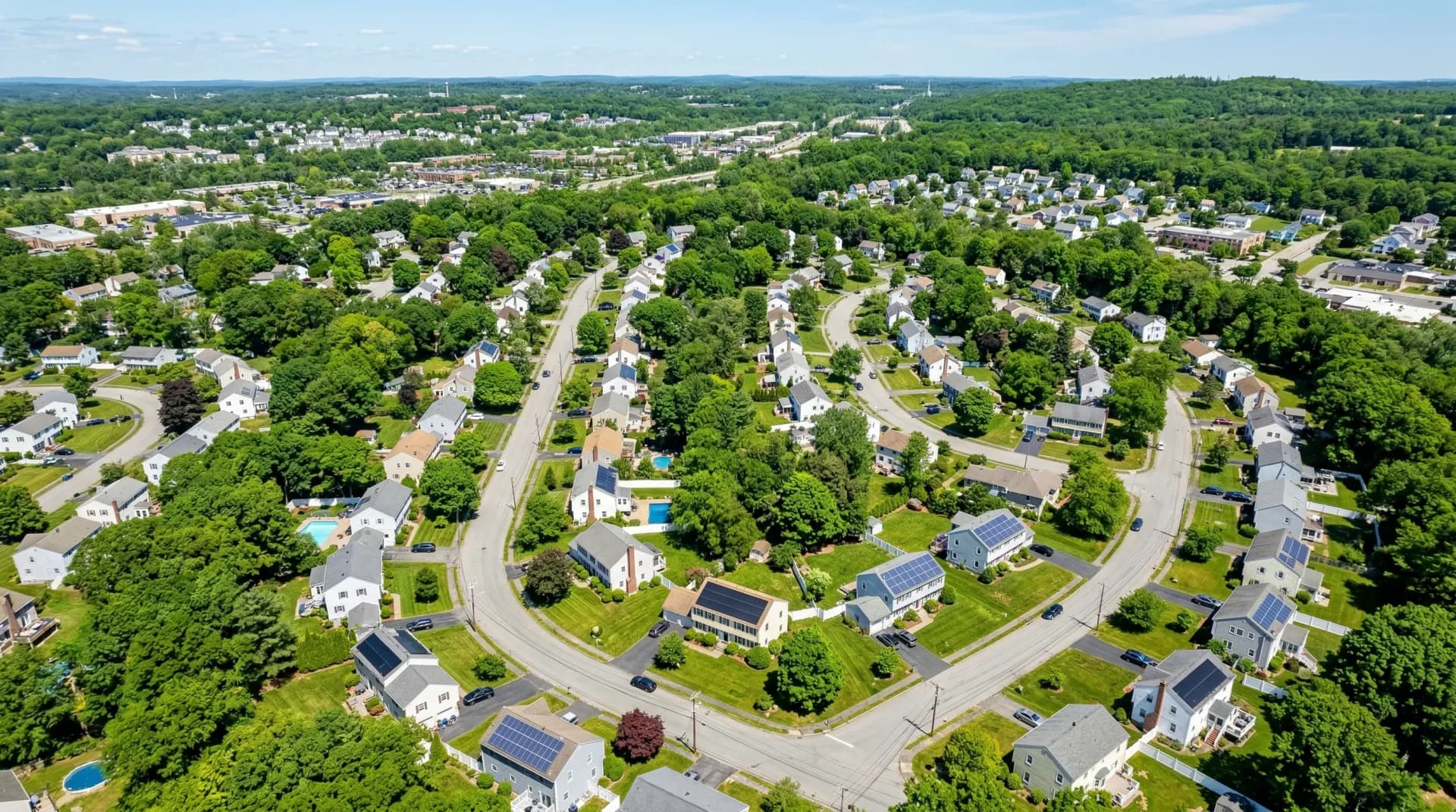 Aerial view of Framingham Massachusetts with solar panels on residential rooftops