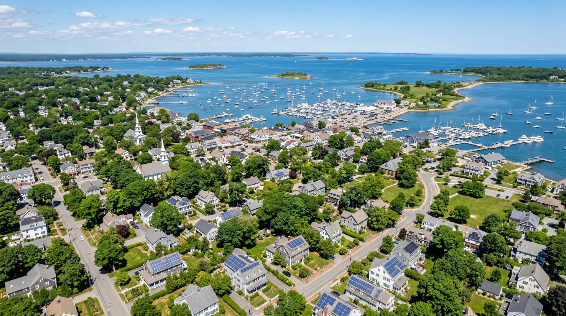 Aerial view of Hingham Massachusetts with solar panels on residential rooftops