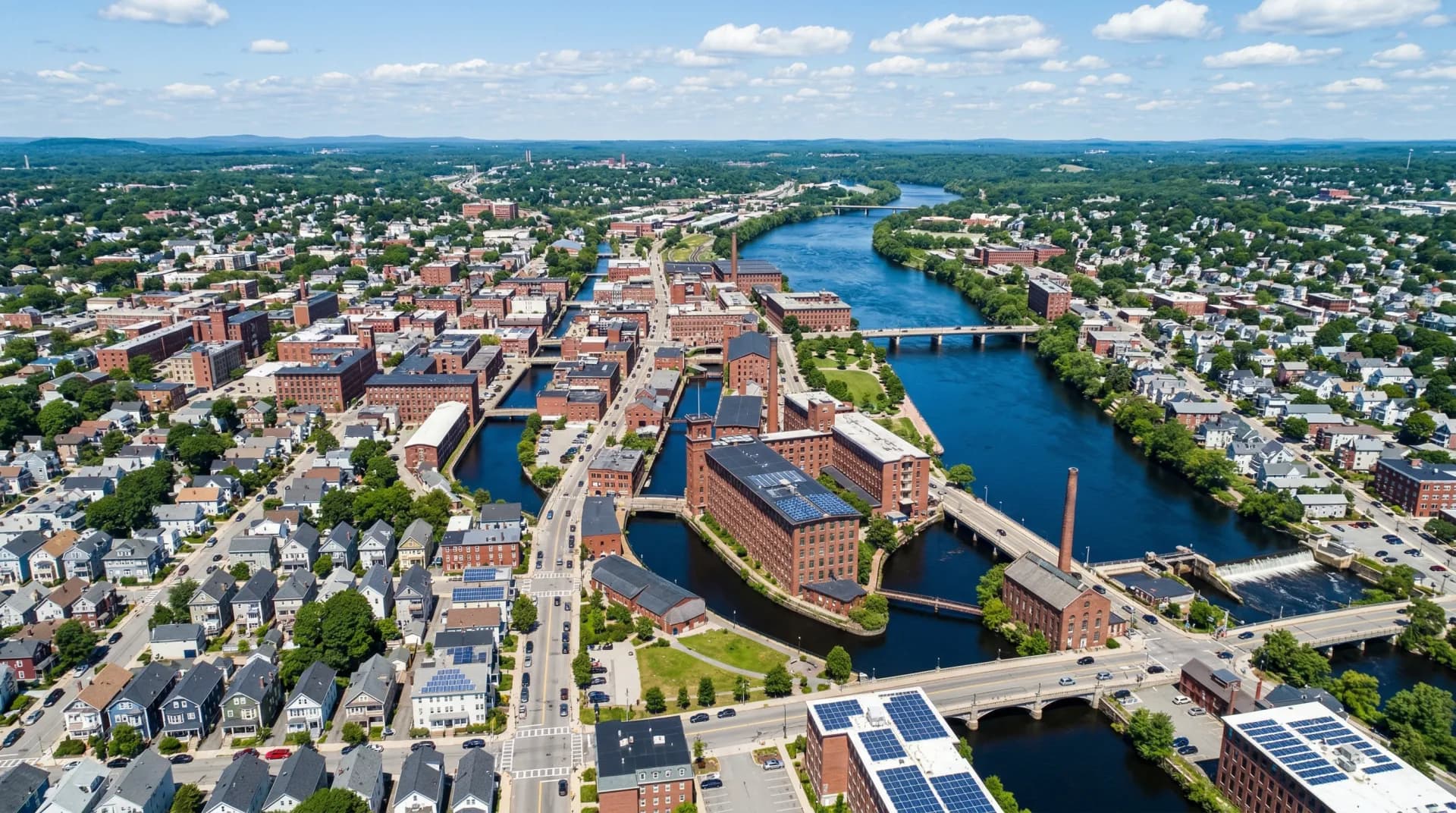 Aerial view of Lowell Massachusetts with solar panels on residential rooftops