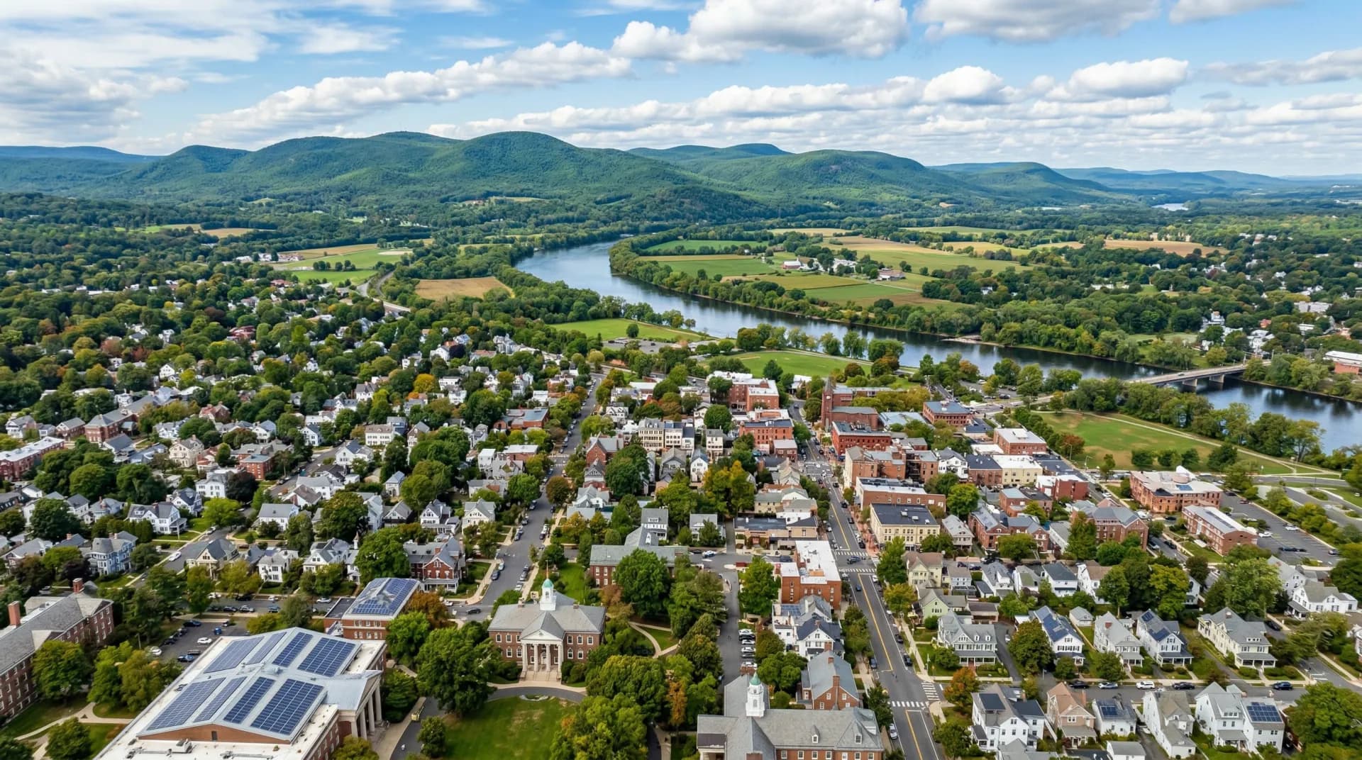 Aerial view of Northampton Massachusetts with solar panels on residential rooftops