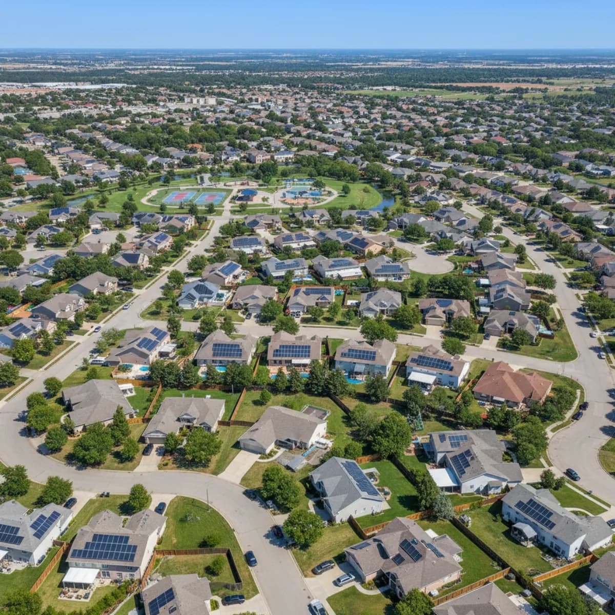 Aerial view of suburban neighborhood with solar homes