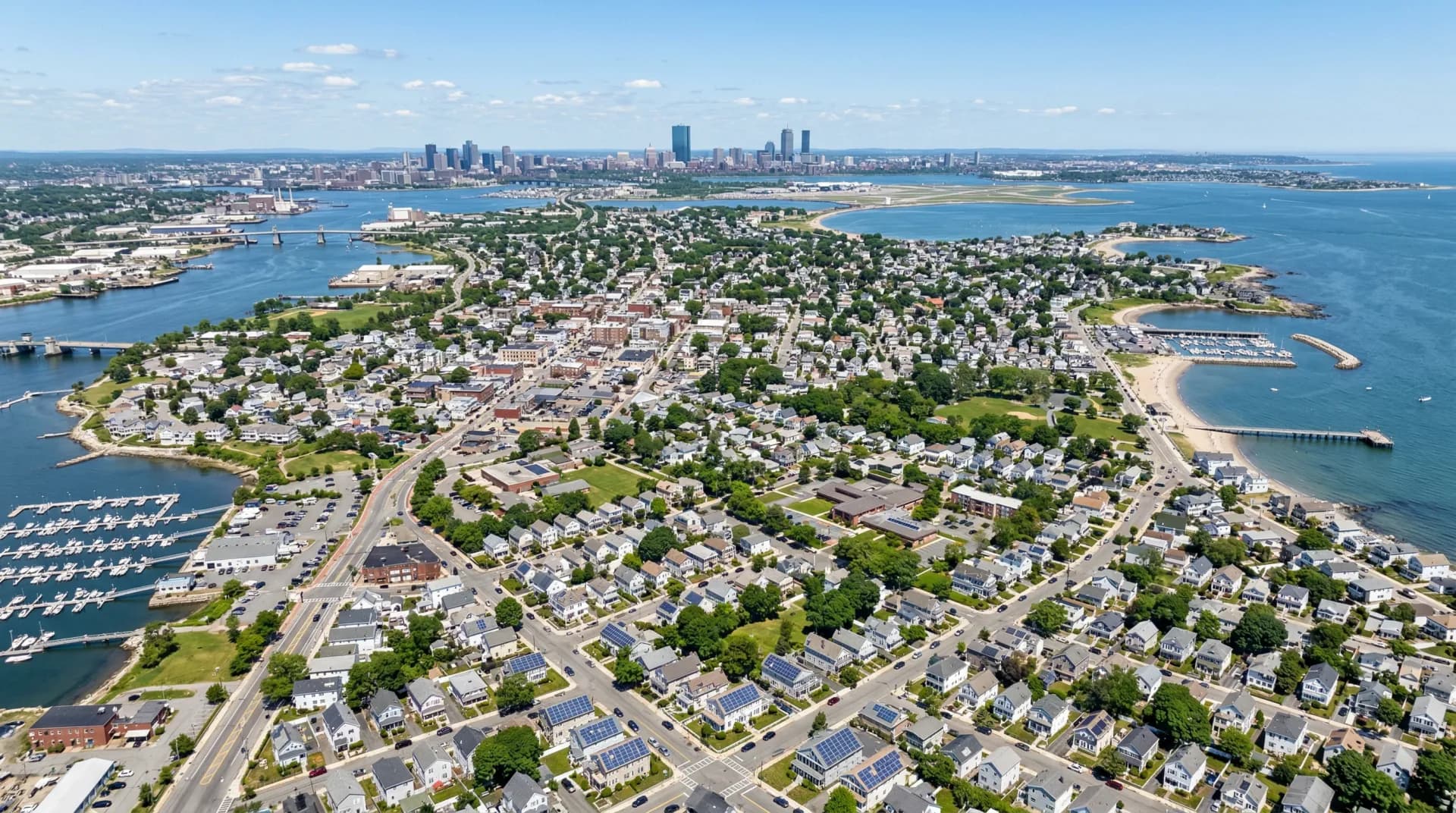 Aerial view of Quincy Massachusetts with solar panels on residential rooftops