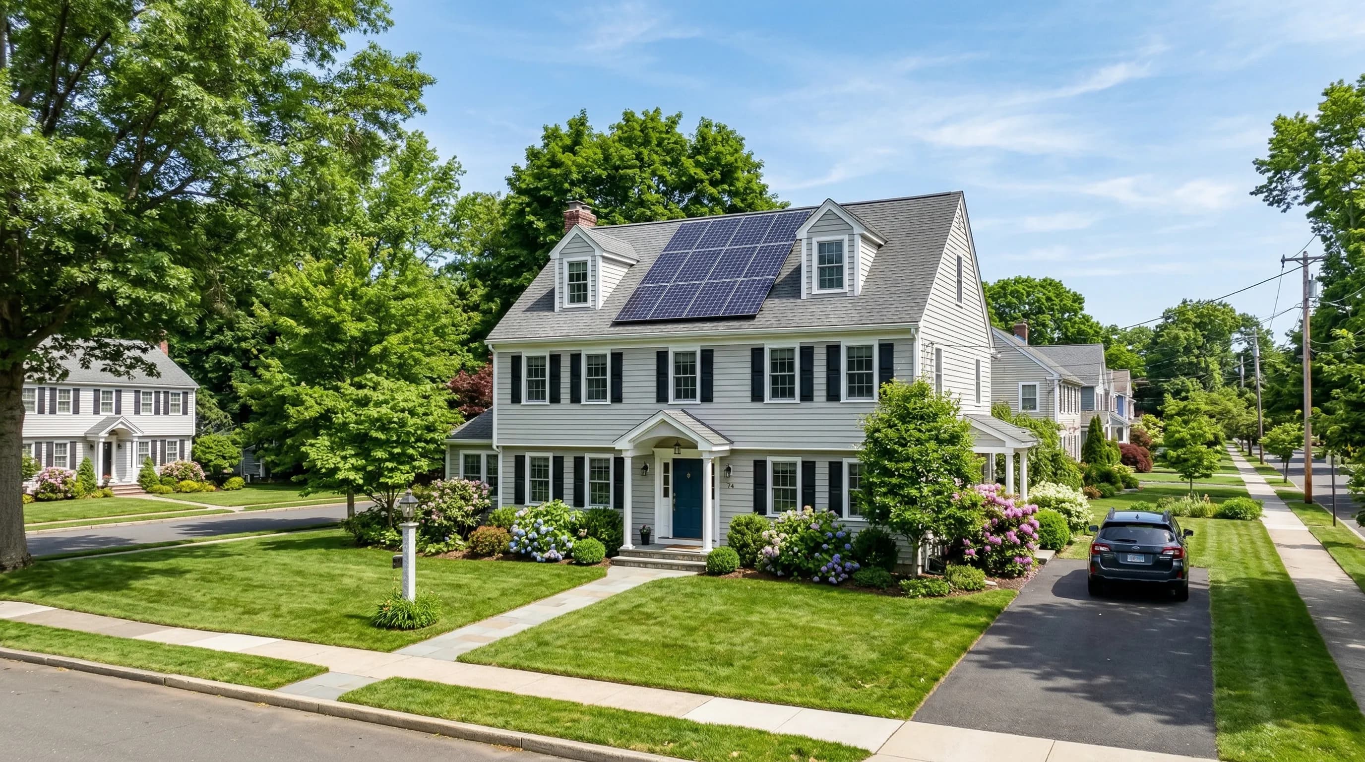Connecticut home with solar panels in suburban neighborhood