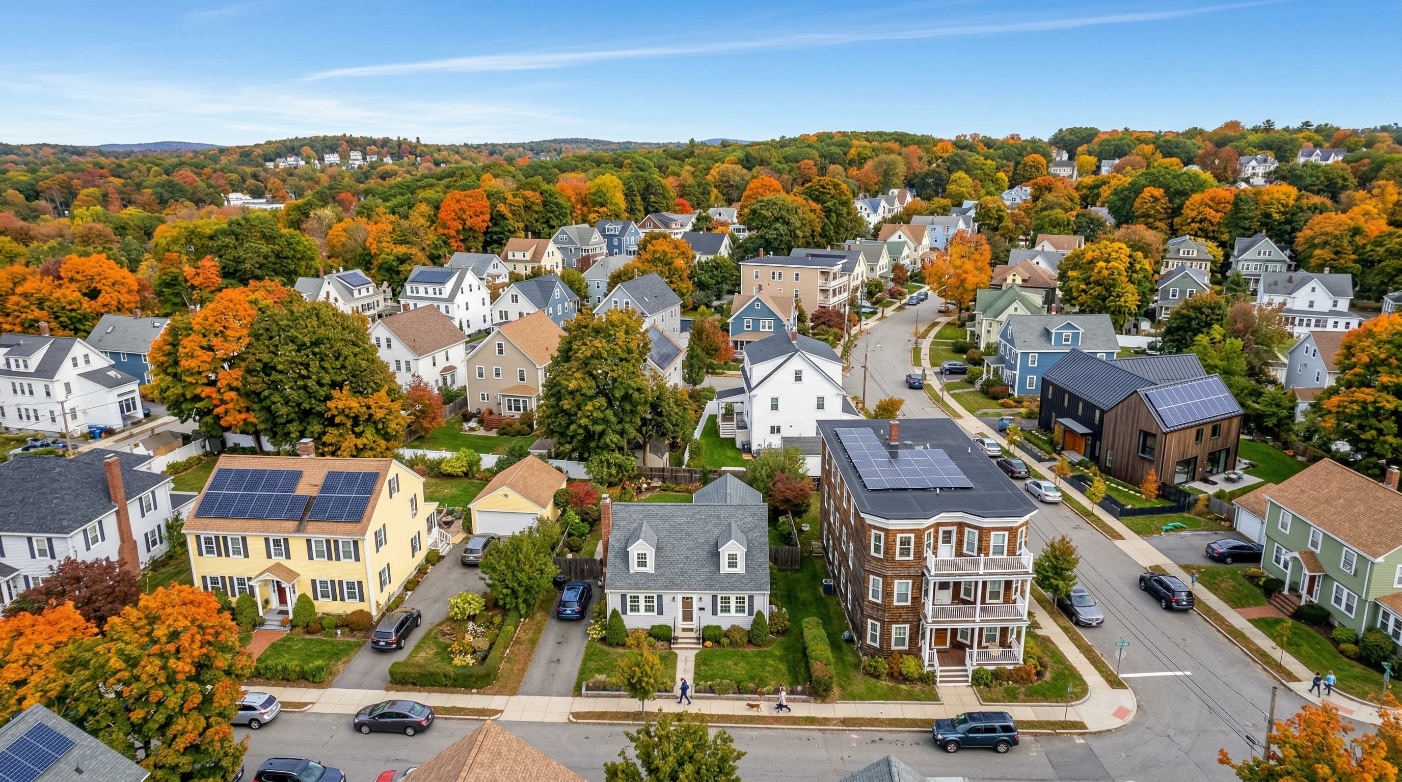 Massachusetts homes showing different roof types with solar panels installed — colonial, cape cod, triple-decker