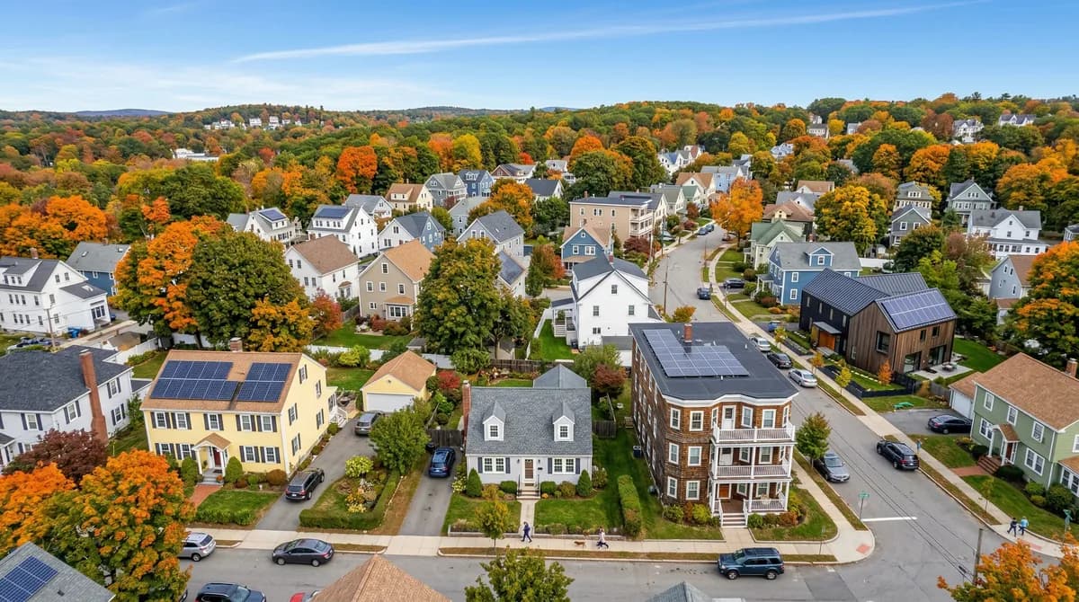 Massachusetts homes showing different roof types with solar panels installed — colonial, cape cod, triple-decker