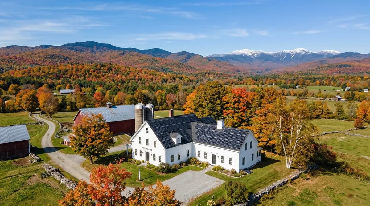 Solar panels on a Vermont home with Green Mountains backdrop