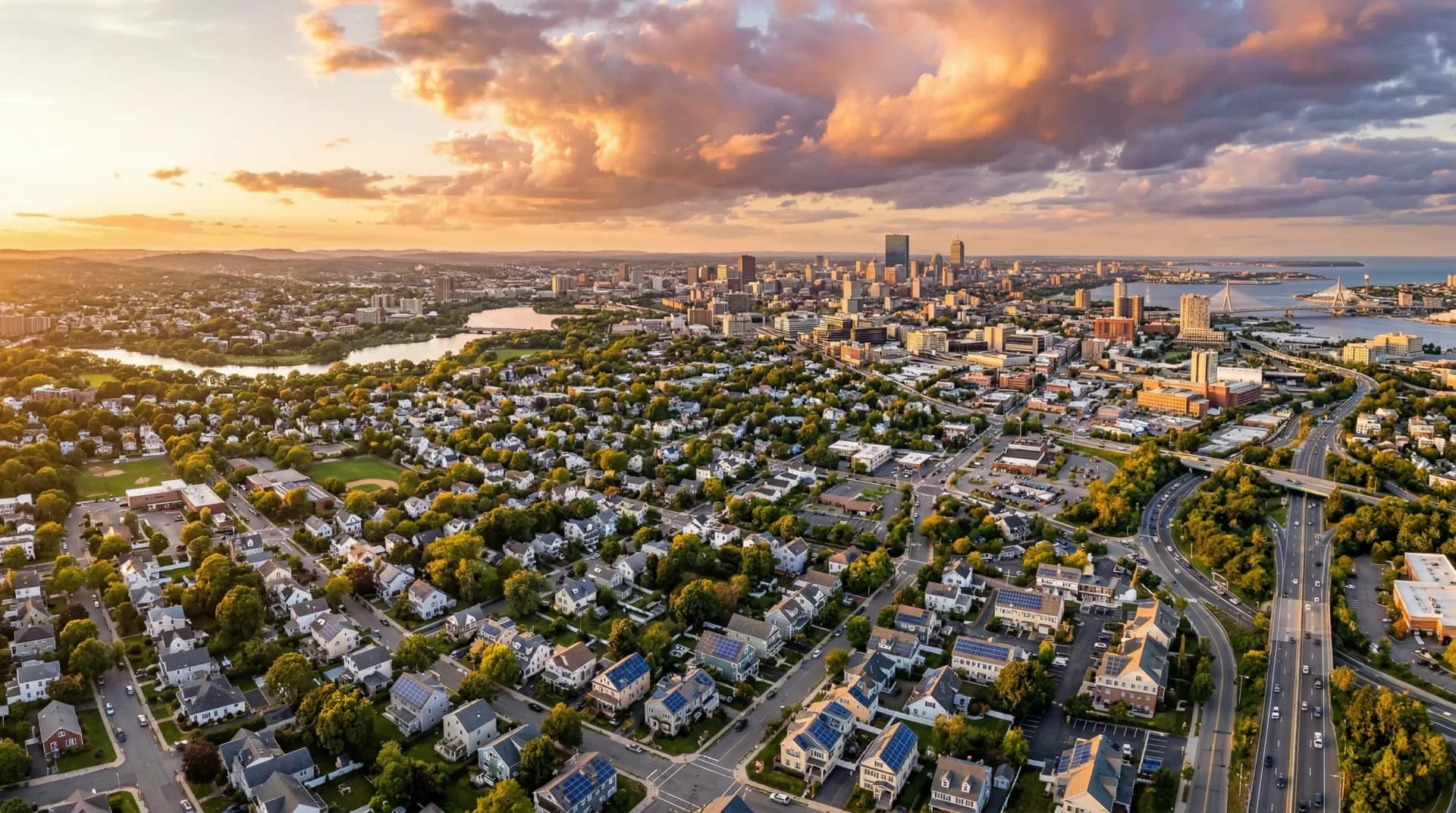 Aerial panoramic view of Massachusetts neighborhoods with solar panel installations